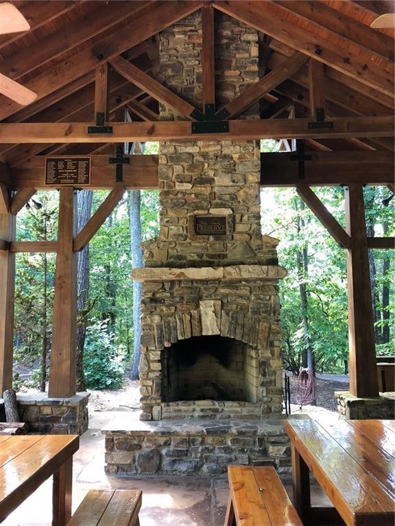 View of patio / terrace with an outdoor stone fire