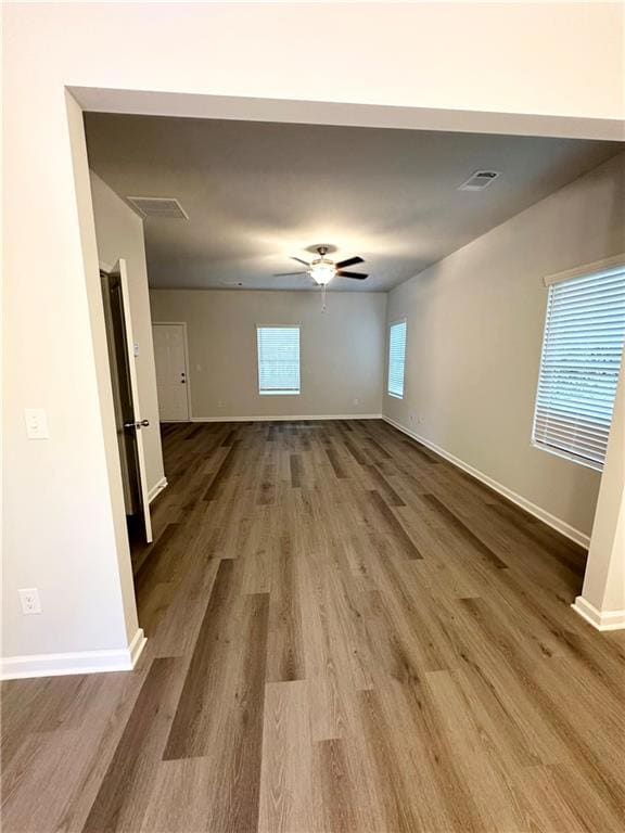 Spare room with ceiling fan and light hardwood / w