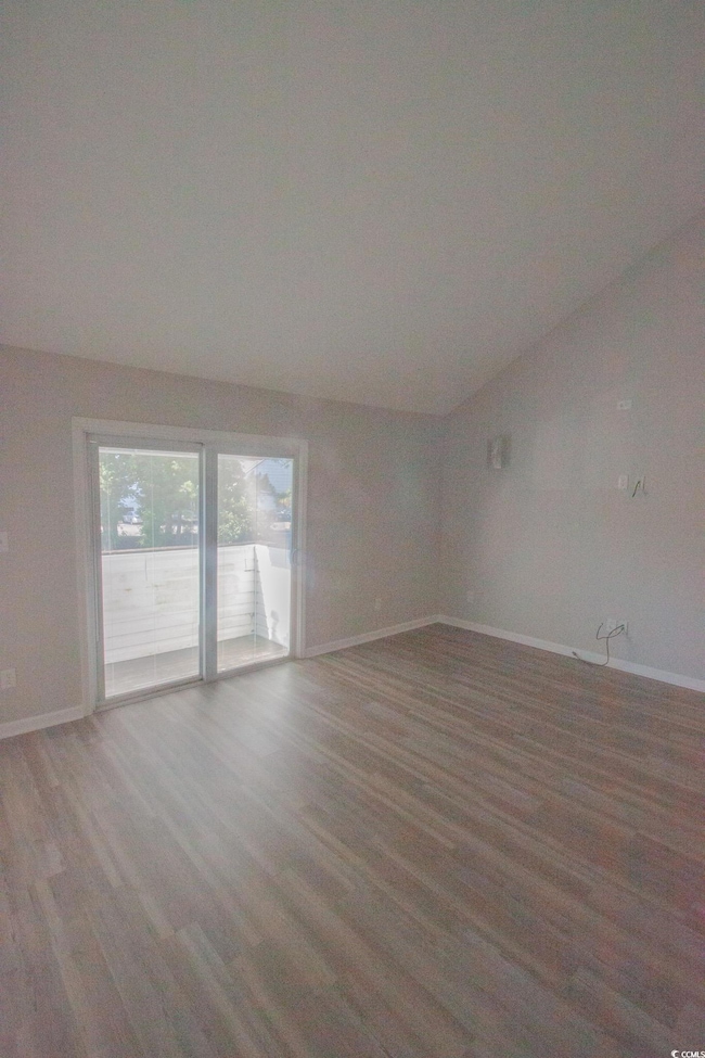 Spare room with light wood-style flooring and baseboards