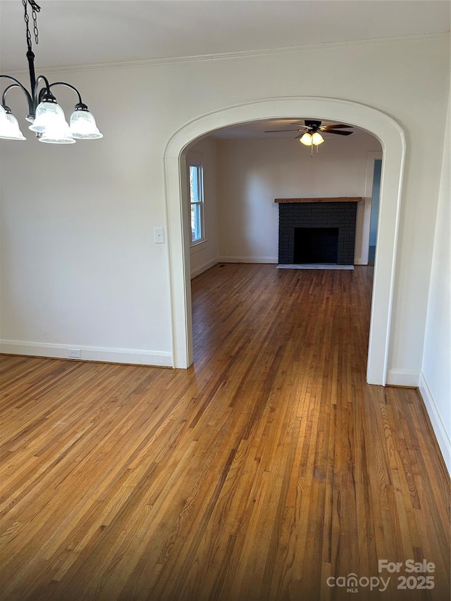 Dining room features arched doorway leading to living room