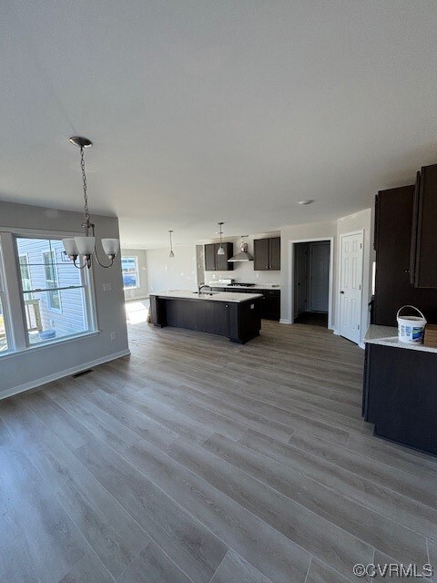 Kitchen with an inviting chandelier, hardwood / wo