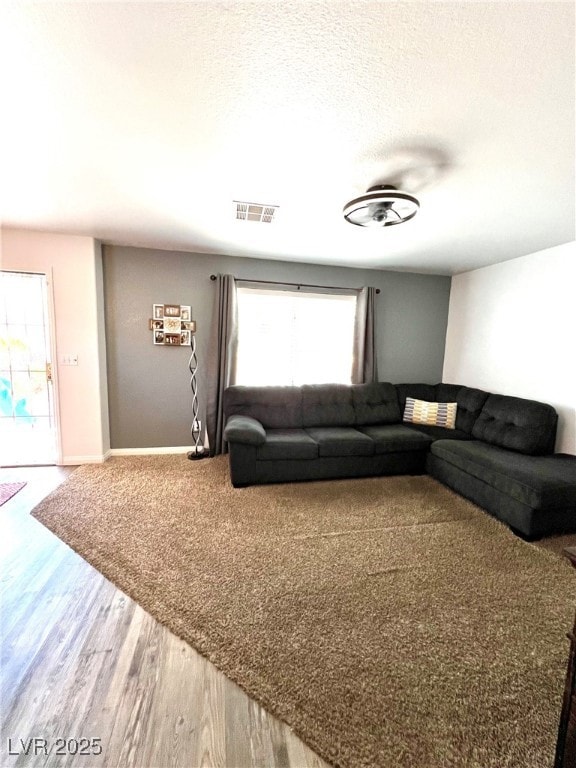 Living area featuring plenty of natural light, woo