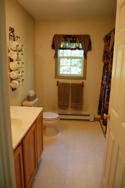 This full bathroom has a very large...