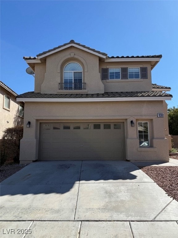 Traditional-style house featuring driveway, stucco