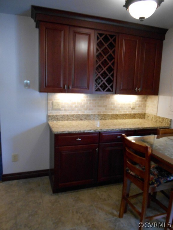 Beautiful Thomasville cabinets have been installed! Granite countertops, tile floor in this completely remodeled kitchen!