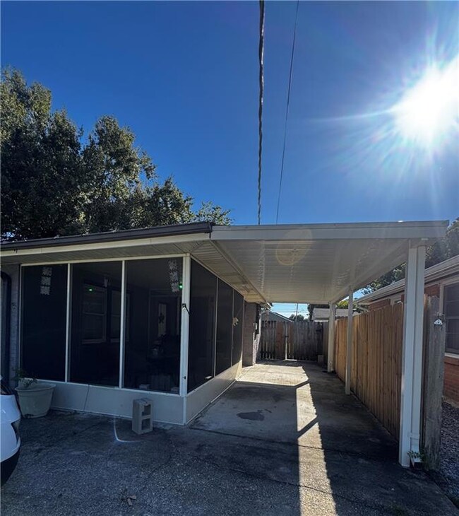 Great attached carport and attached screened porch.  Rear yard access leads to a gigantic back yard.