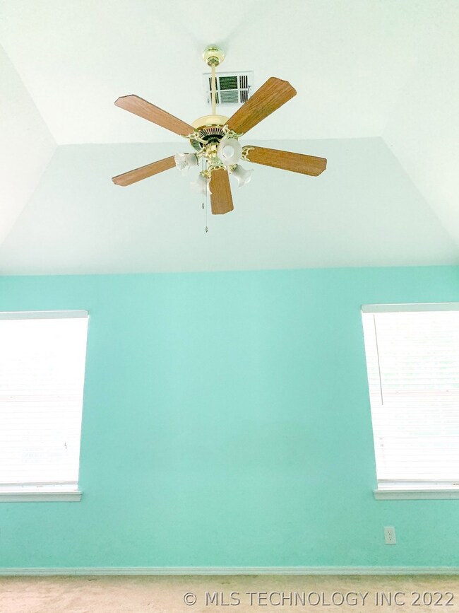 Master bedroom with high coved ceiling.