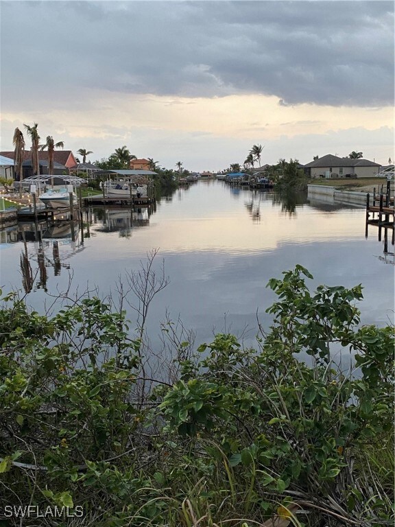 Water view featuring a boat dock