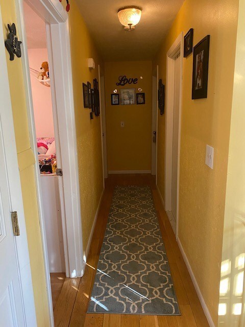 hallway to bedrooms and full bath