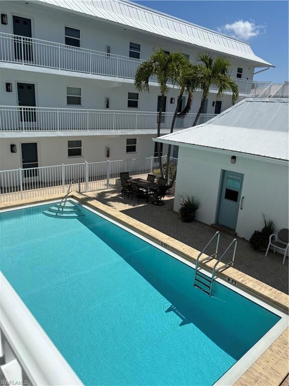 Community pool with a patio area