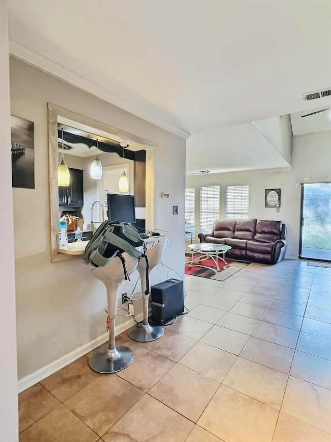 Living room featuring light tile patterned floorin