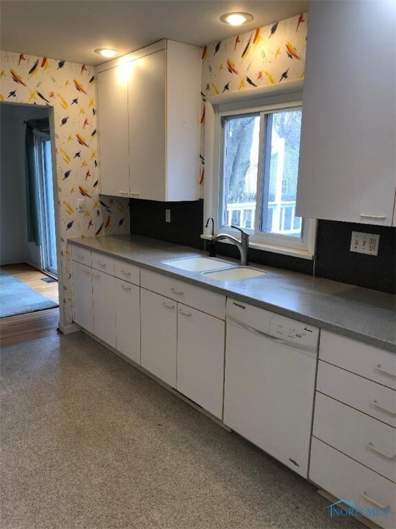 Kitchen over looking large deck in back yard