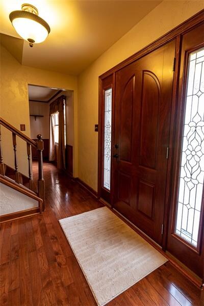 House has solid would entry door, with double lead
