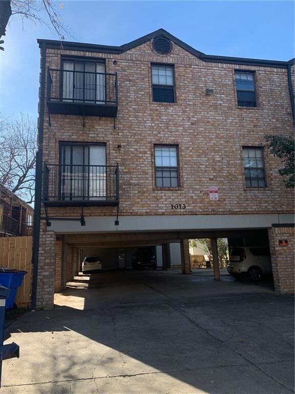 View of building exterior featuring a carport and