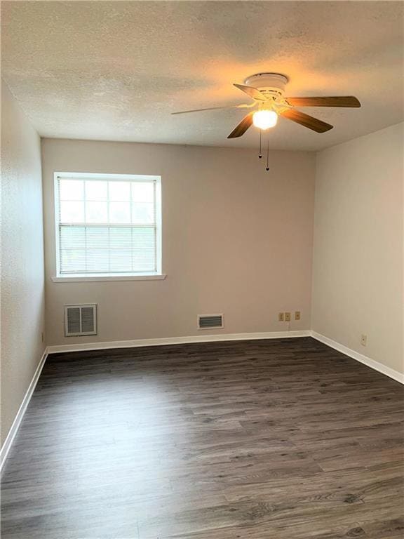 Unfurnished room with a ceiling fan, visible vent