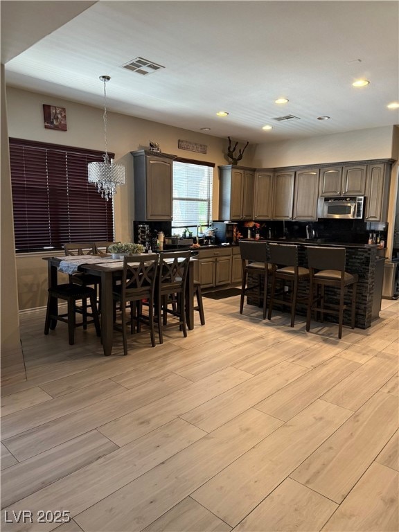 Dining space featuring recessed lighting and light