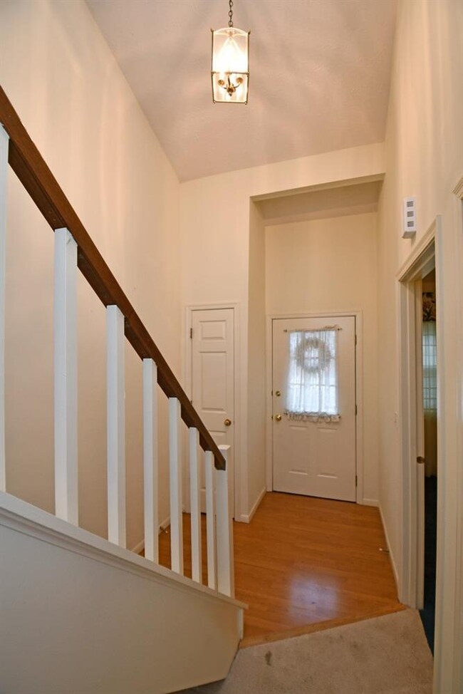 A view back towards the front door.  Vaulted ceili