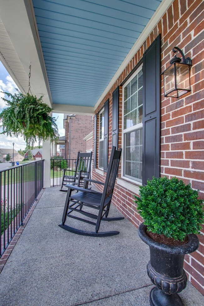 Spacious Front Porch with Painted Ceiling Feature
