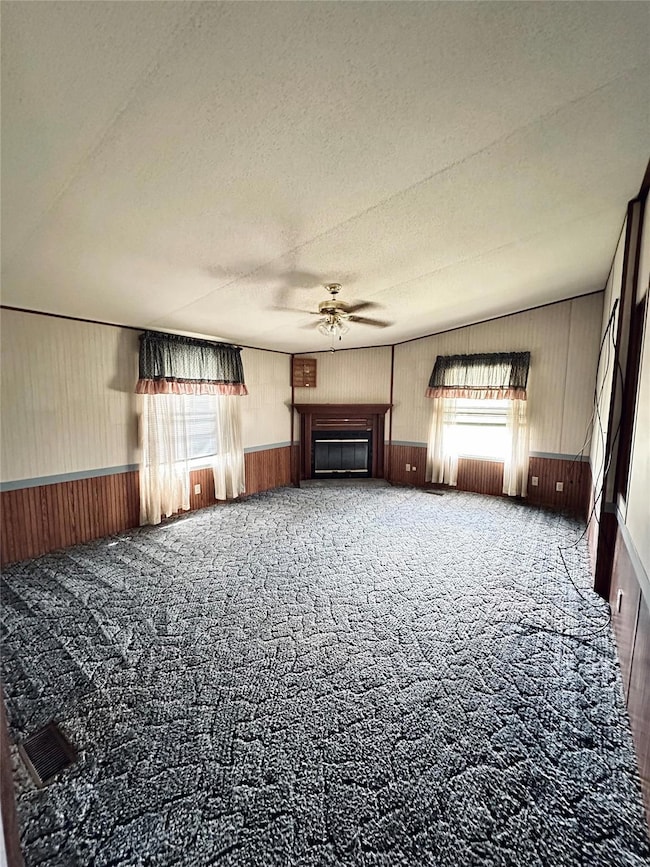 Living room featuring an electric fireplace, carpe