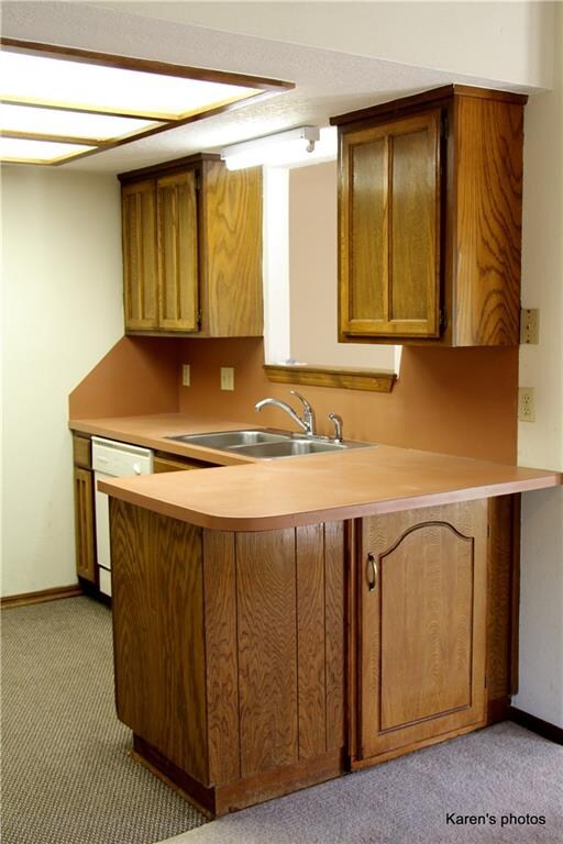 Mini breakfast bar seats two with extra cabinet storage below.