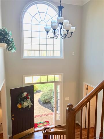 2-story foyer with newly refinished wood floor, fr
