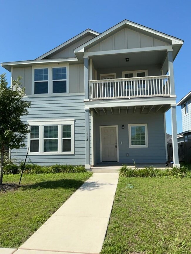 View of front of home featuring a balcony, board 