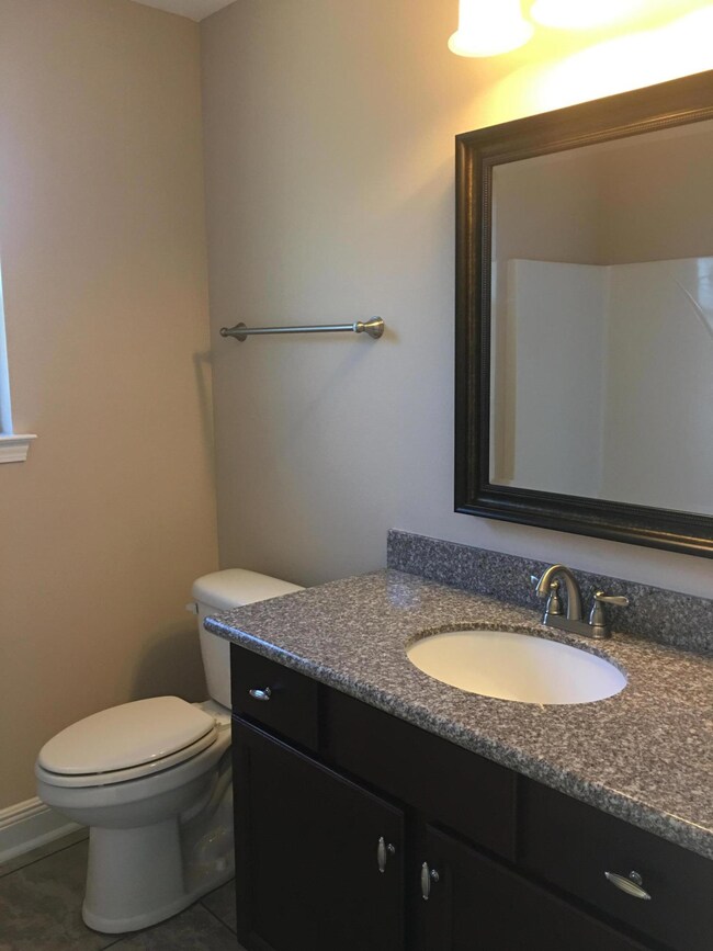 Guest Bathroom.Pictures are of an existing home. This home is being built on Settlers Way.