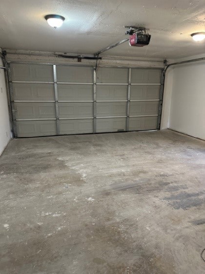 Garage featuring a garage door opener