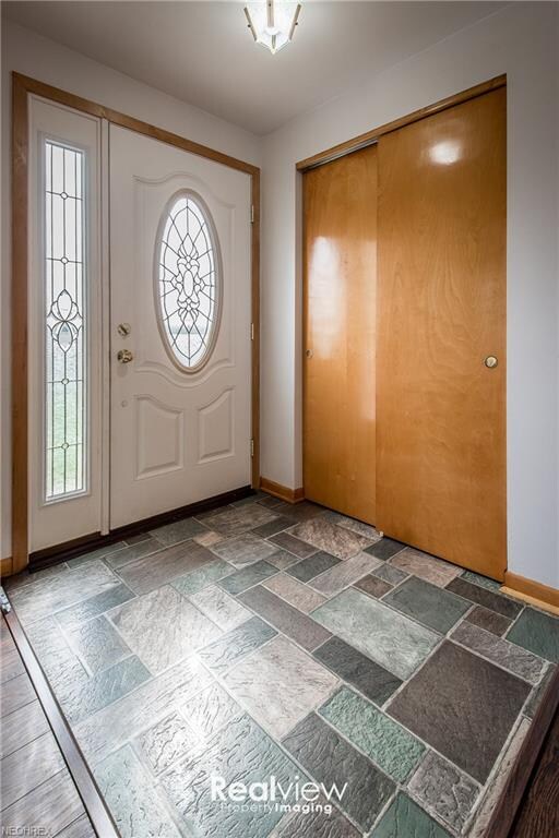 Foyer with double coat closet
