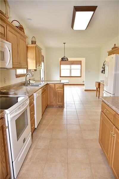 The kitchen flows into the sun room