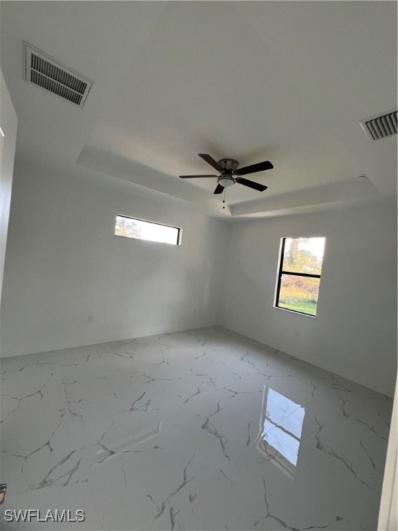 Unfurnished room with marble finish floor, a raise