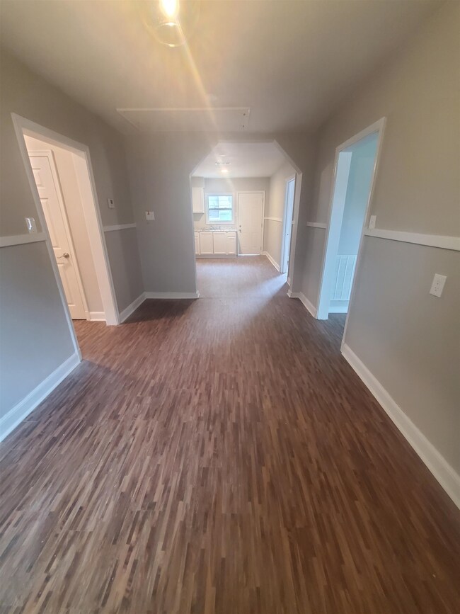 Dining room area with dark wood-type flooring / wo