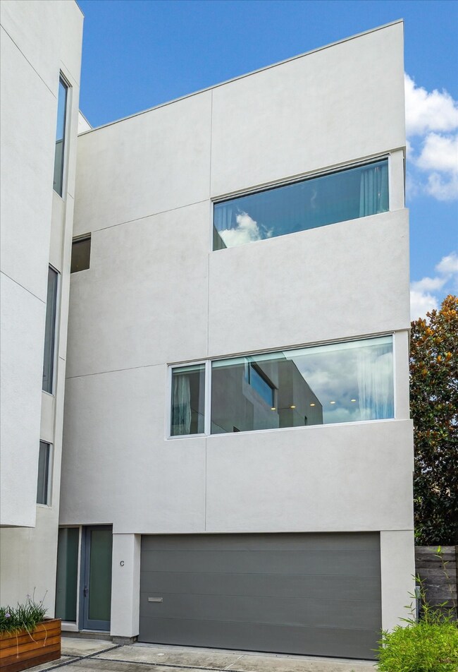 Modern four-story townhouse with a sleek, minimali