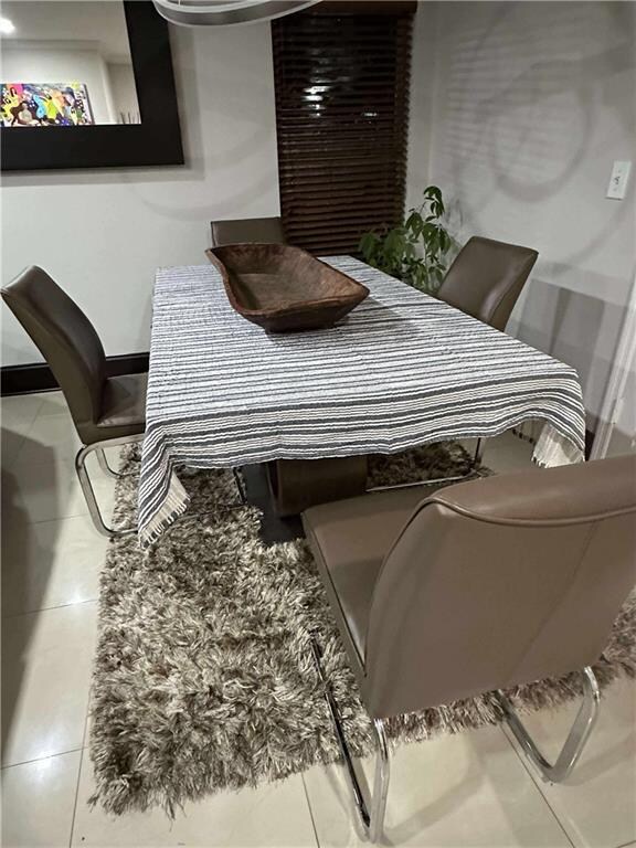Dining room with tile patterned floors