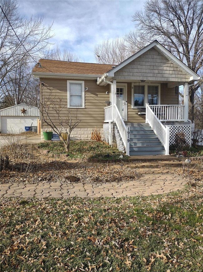 Front porch is composite and papers for a walkway to drive.  Notice int he left rear that HUGE garage...and pole barn.  Ready for tools, toys, or whatever you want to make it.