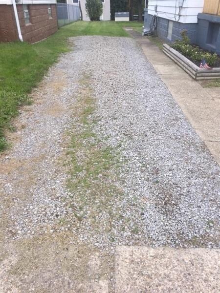 LEVEL GRAVEL AREA TO LEFT OF HOUSE- ENOUGH TO FIT 