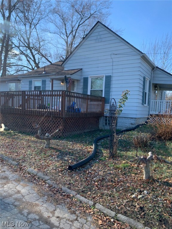 Rear view of property featuring a deck