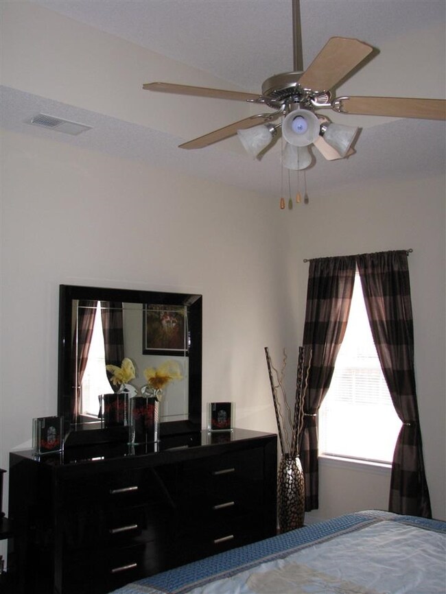 Another view of the master bedroom and vaulted/cof