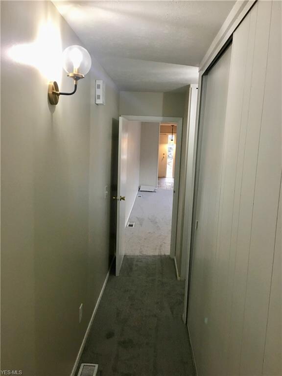 Long hallway to the bedrooms and utility room.  To