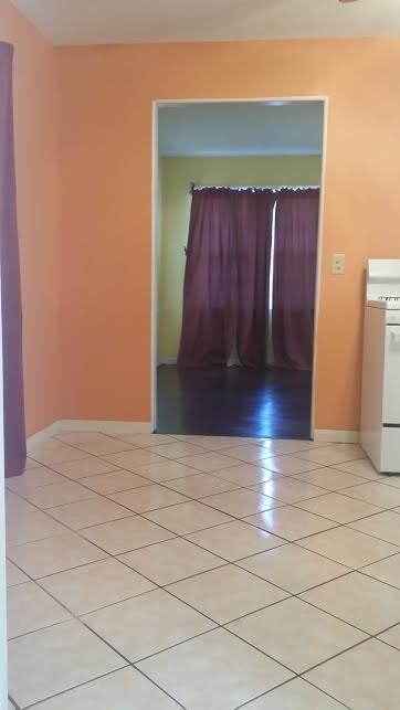 Spacious kitchen & Appliances Remain. Great tile f