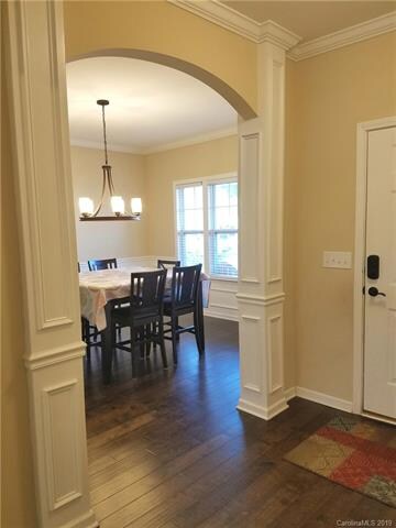 Beautiful archway between front hallway & dining r