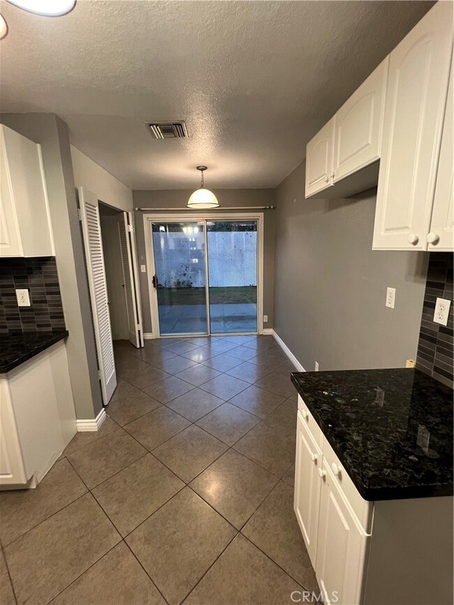 Kitchen opens into the backyard