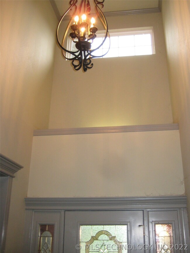 Wrought Iron Entry Light, showing Towering Ceiling