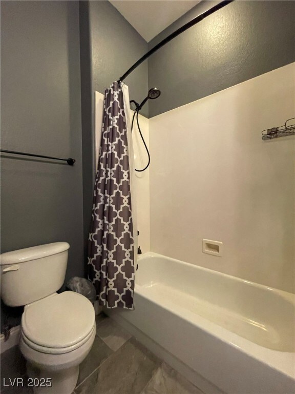 Full bath with toilet and shower / tub combo with