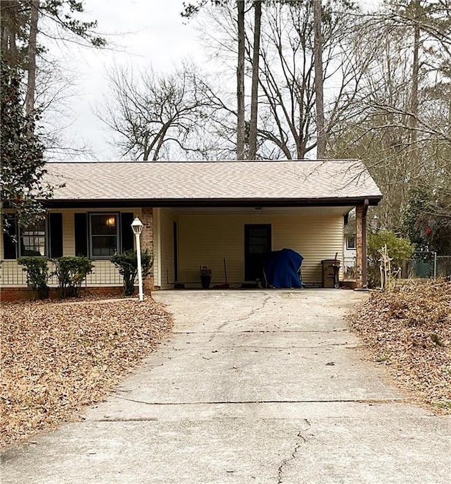View of home's exterior with a carport