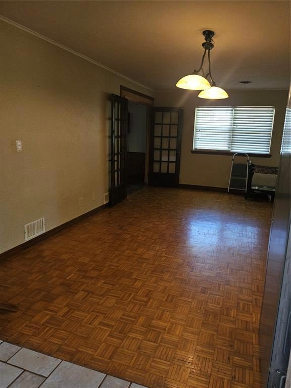 Unfurnished room featuring baseboards and ornamental molding