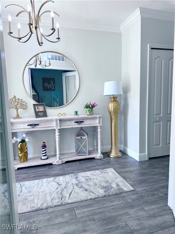 Room details with crown molding and a chandelier