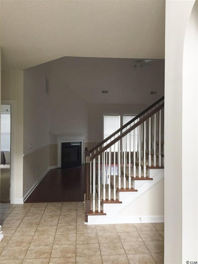 Formal living room to right, master to left, along