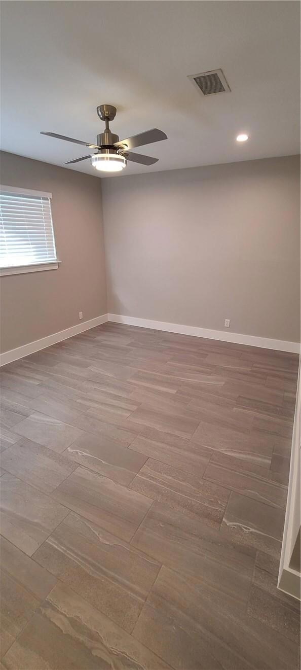 Unfurnished room featuring a ceiling fan, recesse