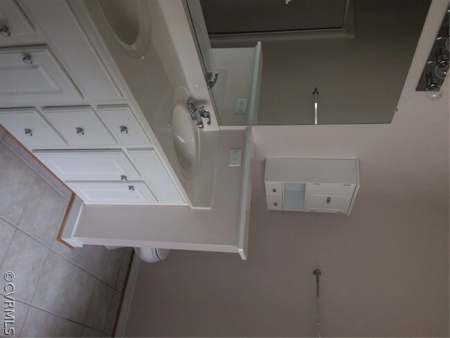 Master bath with tile flooring and fresh paint